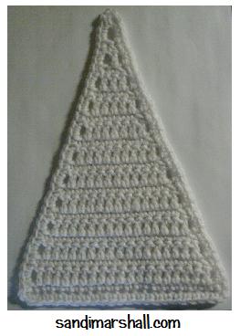 tall triangle crocheted in white worsted weight yarn