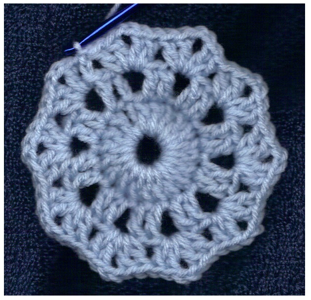 crocheted round motif in blue worsted weight yarn with free pattern at sandimarshall.com