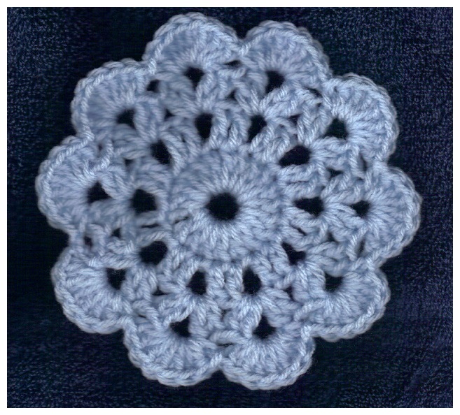 four rounds of crocheted circular motif from free pattern at sandimarshall.com crochet instructions by Sandi Marshall